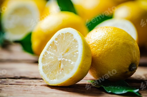 Preview: Fresh lemons. On wooden table.