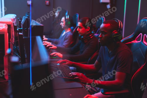 Online gamers playing strategy games in computer club