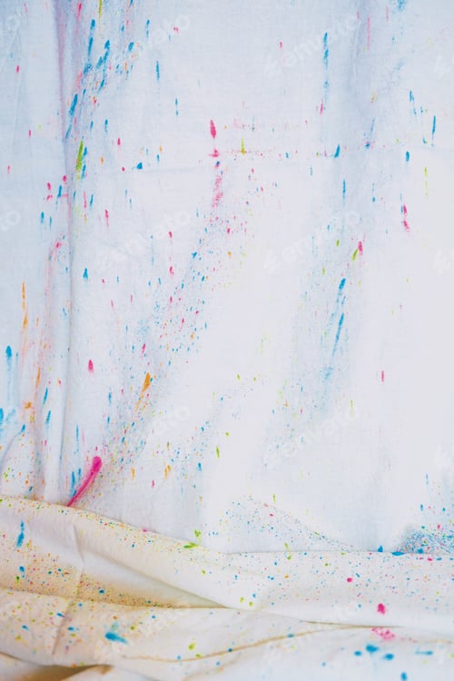 Preview: Holi dust splash over a white curtain