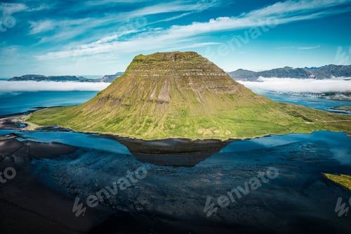 Preview: Kirkjufell mountain with foggy by Atlantic ocean in summer at Snaefellsnes peninsula