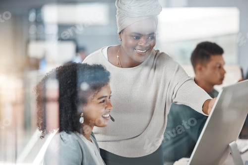 Preview: African american call centre telemarketing agent training new mixed race assistant on a computer in
