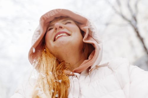 Preview: Portrait positive middle-aged woman enjoying snowfall