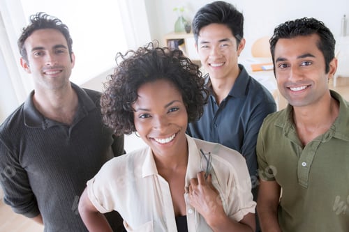 Preview: A diverse group of smiling professionals posing together