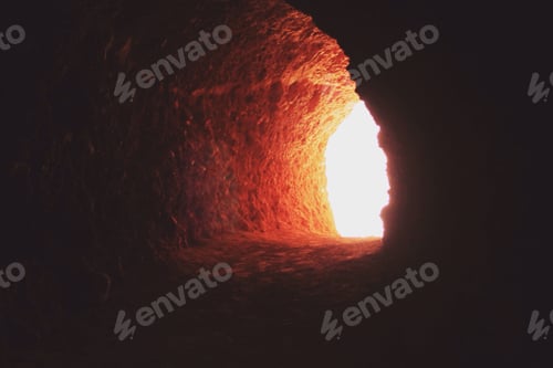 Preview: Light at the end of a tunnel in a cave.