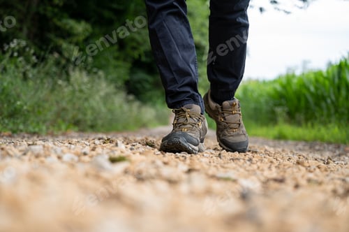 Preview: Male in hiking shoes walking on a trail