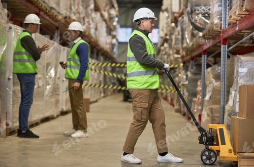 Preview: Shot of three workers doing operations in storage warehouse
