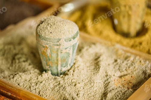 Preview: Close Grated Nutmeg Fragrant Seasoning Condiment In Glass In Tra