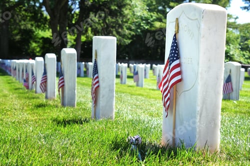 Preview: Unknown Soldier tombstone in a Veterans Cemetery decorated with American Flags