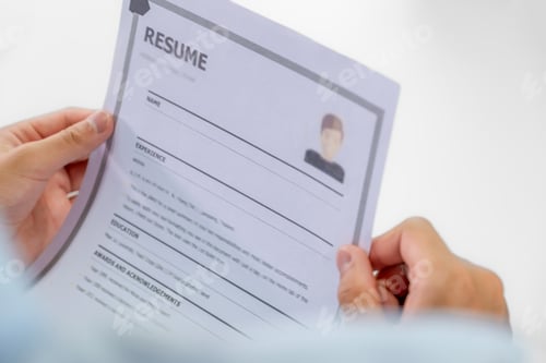 Preview: hand holding resume for Office executives interviewing job applicants in the meeting room.