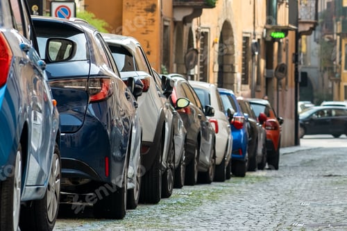 Preview: Modern cars parked on city street side in residential discrict.