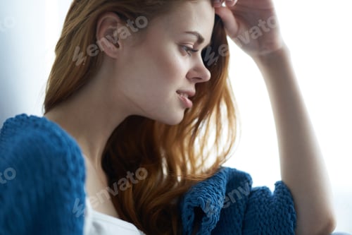 Preview: pretty woman in blue plaid sits on the windowsill home interior charm