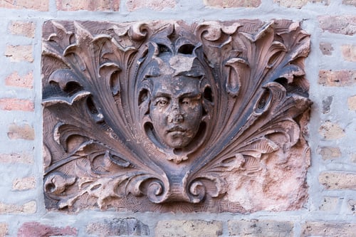 Preview: Stone Face Decoration On A Brick Building Wall