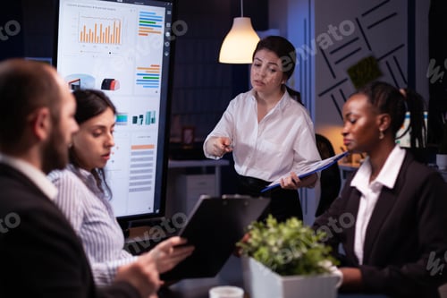 Preview: Diverse multi ethnic teamwork brainstorming company ideas analyzing financial graphs presentation