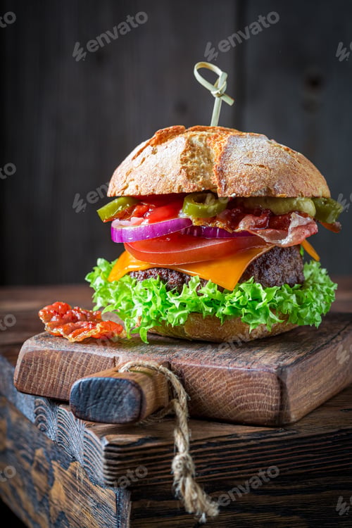 Preview: Sandwich with bacon, tomato and beef. American cuisine.