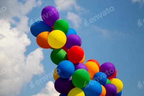 Preview: Low angle shot of colorful balloons on background of the sky