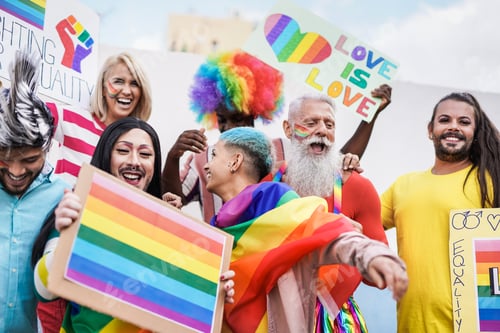 Preview: Multiracial people having fun at gay pride parade with banner - Concept of homosexual love and lgbt