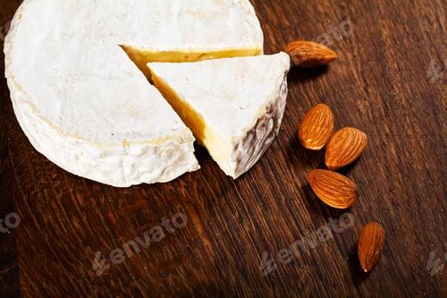 Preview: Camembert cheese or brie on wood background