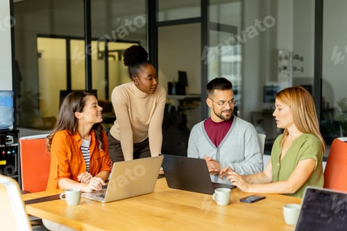 Preview: Young multiethnic startup team working in the modern office