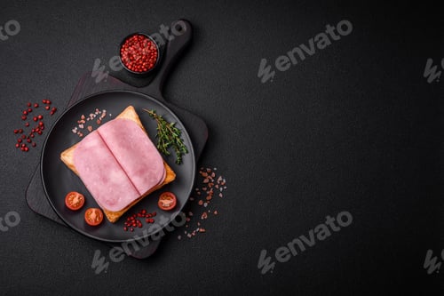 Preview: Delicious sandwich with toast bread, ham, tomatoes, salt and spices