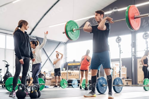 Preview: People in gym weightlifting