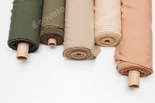 Preview: pastel color fabric rolls isolated on white, Synthetic and natural fabrics with copyspace.