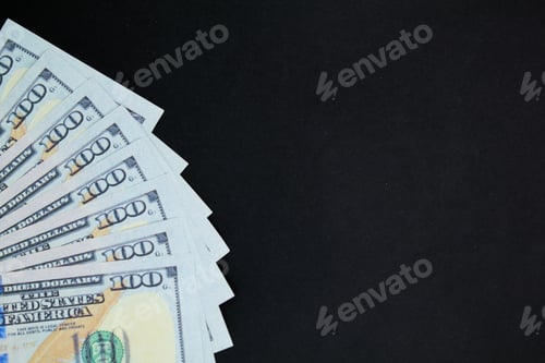Preview: Crisp One Hundred Dollar Bills on Dark Background