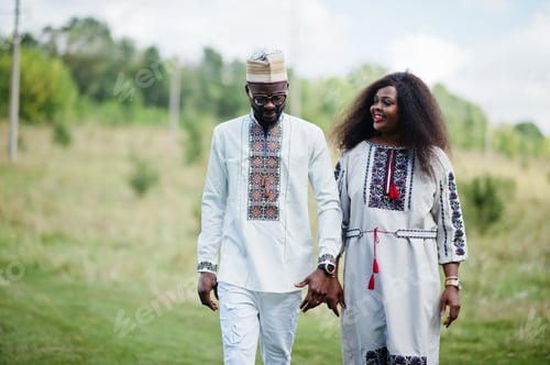 Preview: African couple in traditional clothes at park.