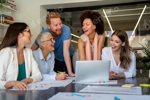 Preview: Smiling diverse colleagues gather in boardroom brainstorm discuss financial statistics together