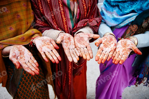 Preview: Cropped shot of three local women with henna mehndi on hand palms, Bikaner, Rajasthan, India