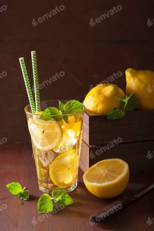 Preview: ice tea with lemon and mint on dark rustic background