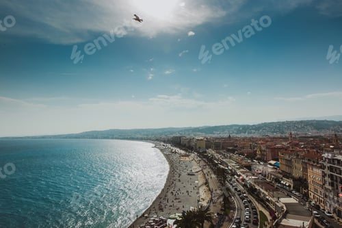 Preview: Panoramic view of Nice coastline and beach with blue sky, France