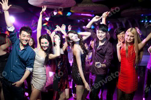 Preview: Stylish young people dancing in nightclub