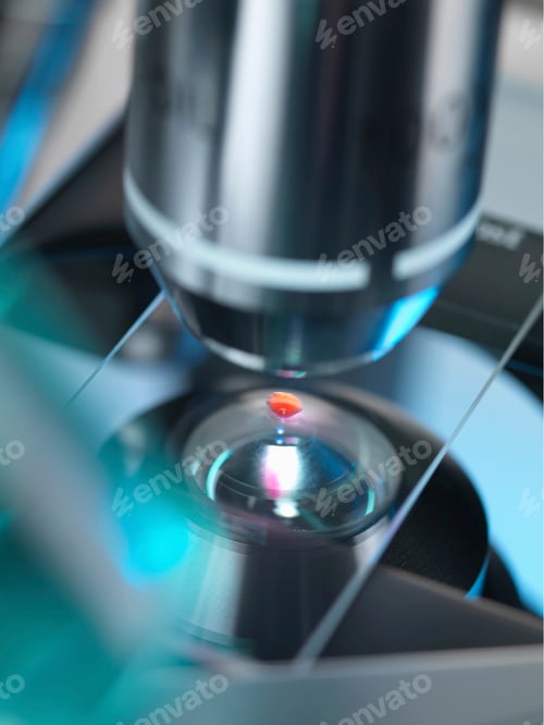 Preview: A light microscope examining a sample in lab for pharmaceutical research