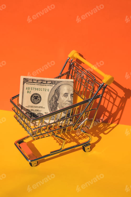 Preview: US dollar paper currency 100 banknote money Shopping trolley cart on colorful orange yellow