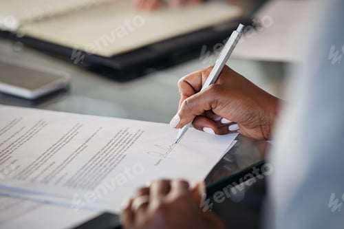 Preview: Close up of black businesswoman hand signing contract at office