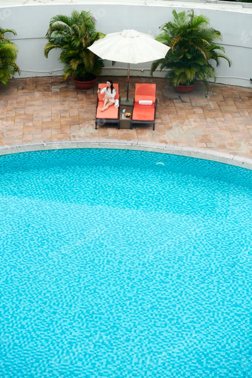 Preview: Woman Making Video Call Near Pool