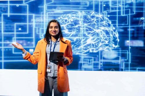 Preview: Cheerful engineer holding presentation at AI tech summit using tablet