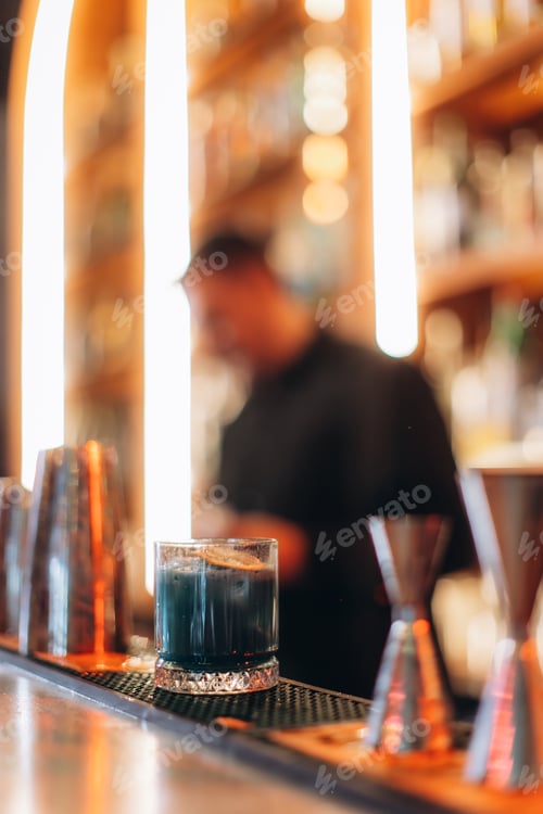 Preview: Elegant Cocktail on a Bar With Background Lighting and Decor