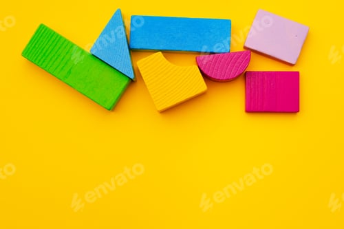 Preview: Toy kid's constructor on yellow background top view