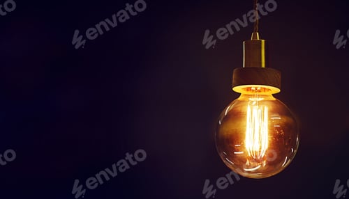 Preview: Light up your life. Cropped shot of a lightbulb turned on isolated on black.