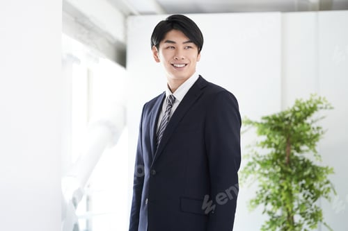 Preview: A Japanese male businessman with a smile.