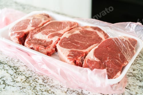 Preview: Unpacking Rib Eye Steak in Modern Kitchen