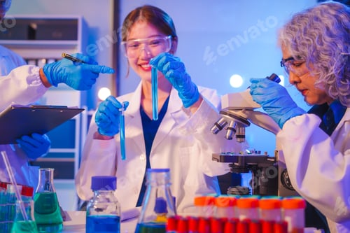 Preview: Two Asian men and women sit at a table in a laboratory, conducting research on liquids. They use