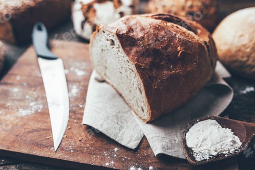 Preview: Delicious fresh bread on wooden background