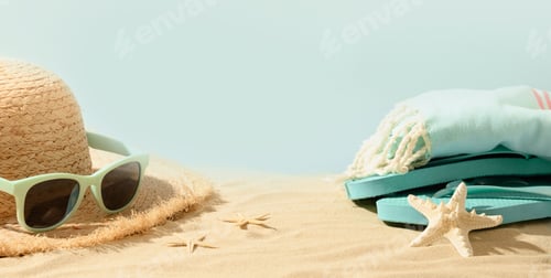 Preview: Beach straw sun hat, seashells and eyeglasses on sand. Summer holiday vacation.