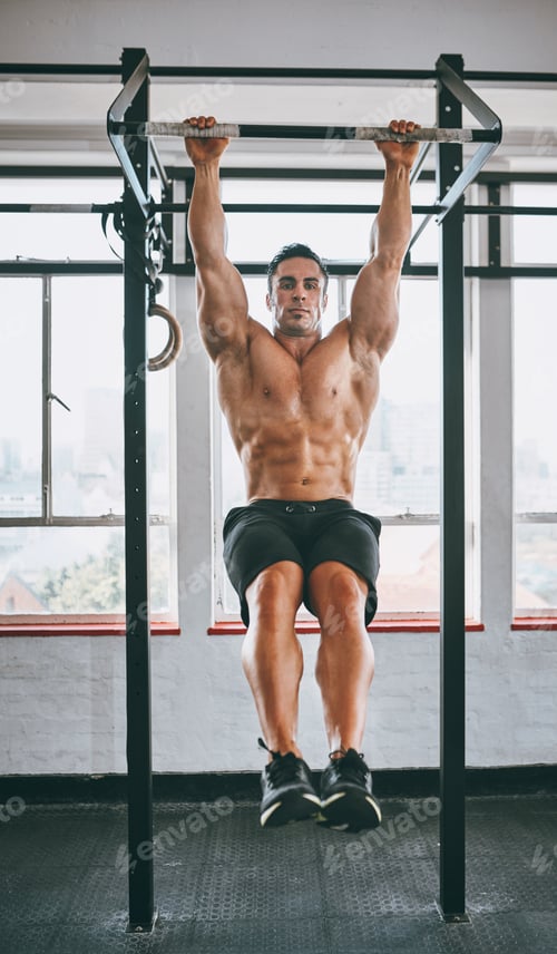 Preview: Aim high. Shot of a muscular man working out in a gym.