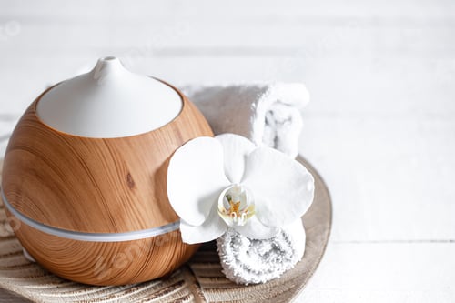 Preview: Spa composition with aroma diffuser, towel and orchid flower as decor.