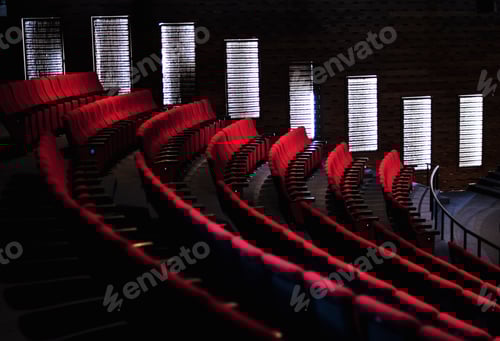 Preview: Rows of red seats in a theater