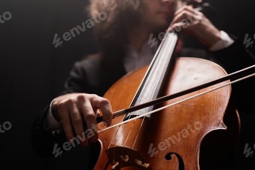 Preview: Musician Playing Cello with Bow on Strings