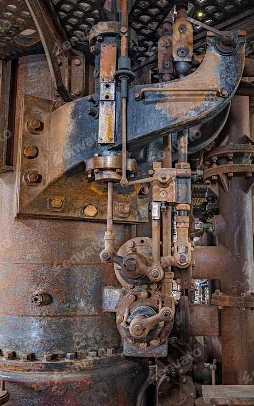 Preview: Close-up of a vintage industrial machine with rust and metal parts.